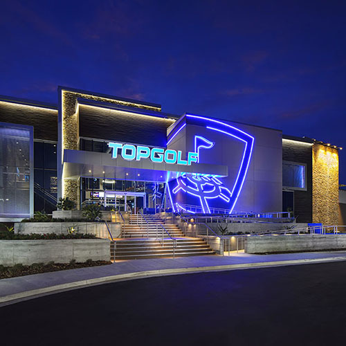 Image of the front of Top Golf building at night
