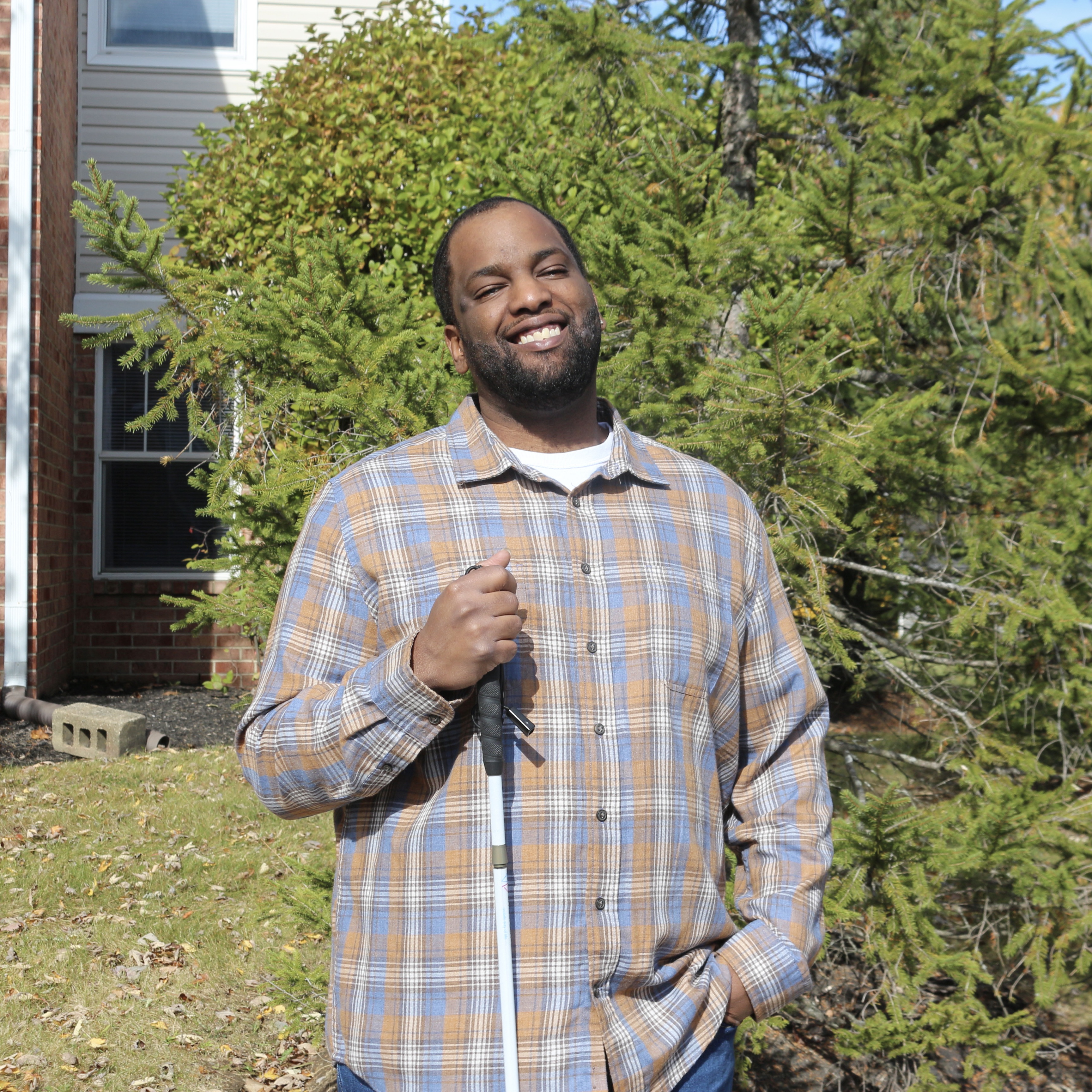 Man posing for a picture outside