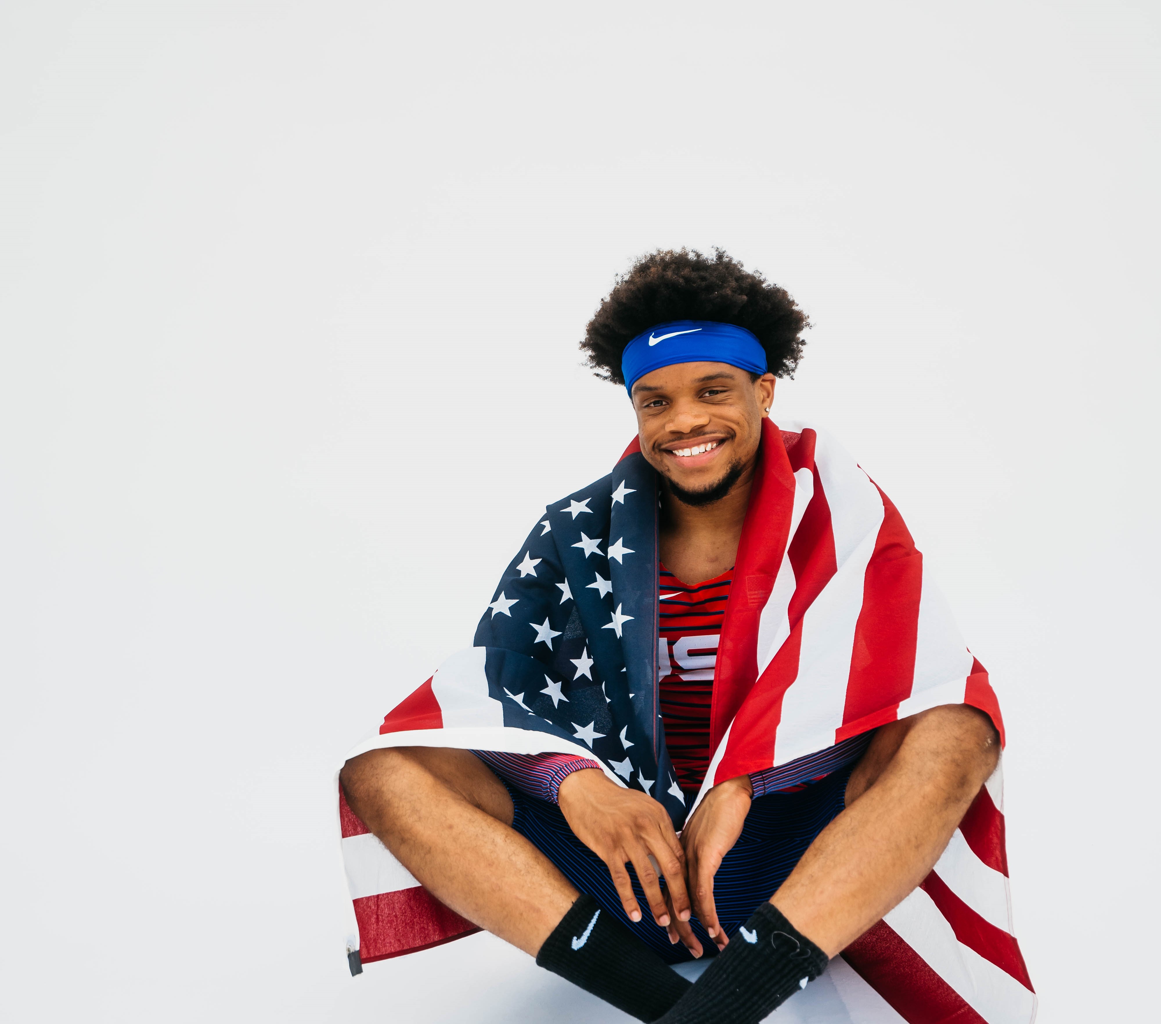 Noah draped in an American flag.