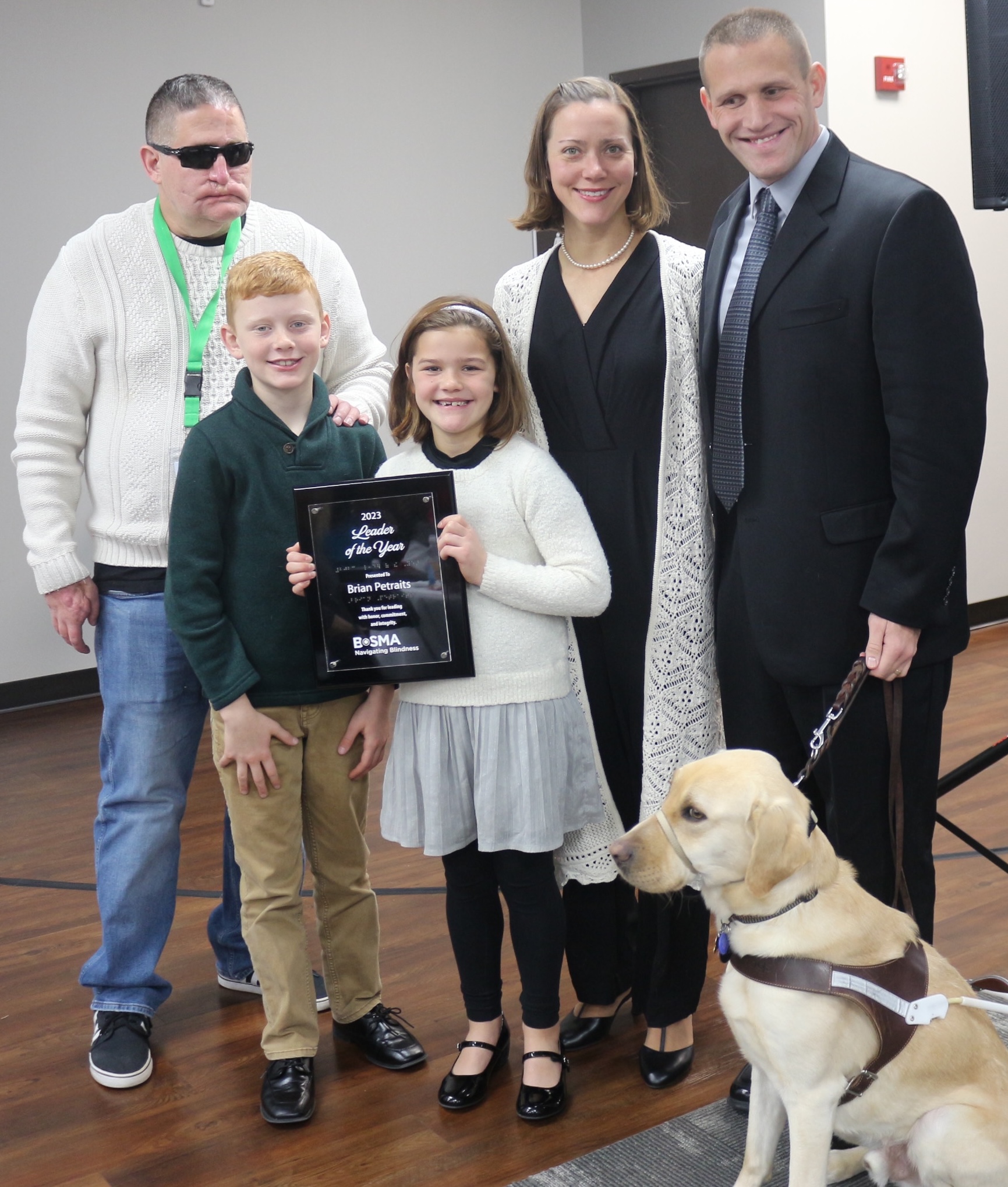 Brain Petraits with his wife and two children and Jeff Mittman, Bosma president and CEO