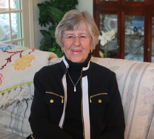 Barbara Rager is pictured sitting in her living room