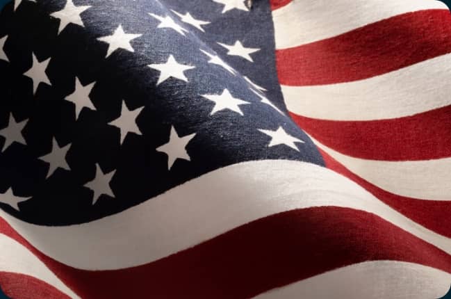 United States flag waving in the wind.
